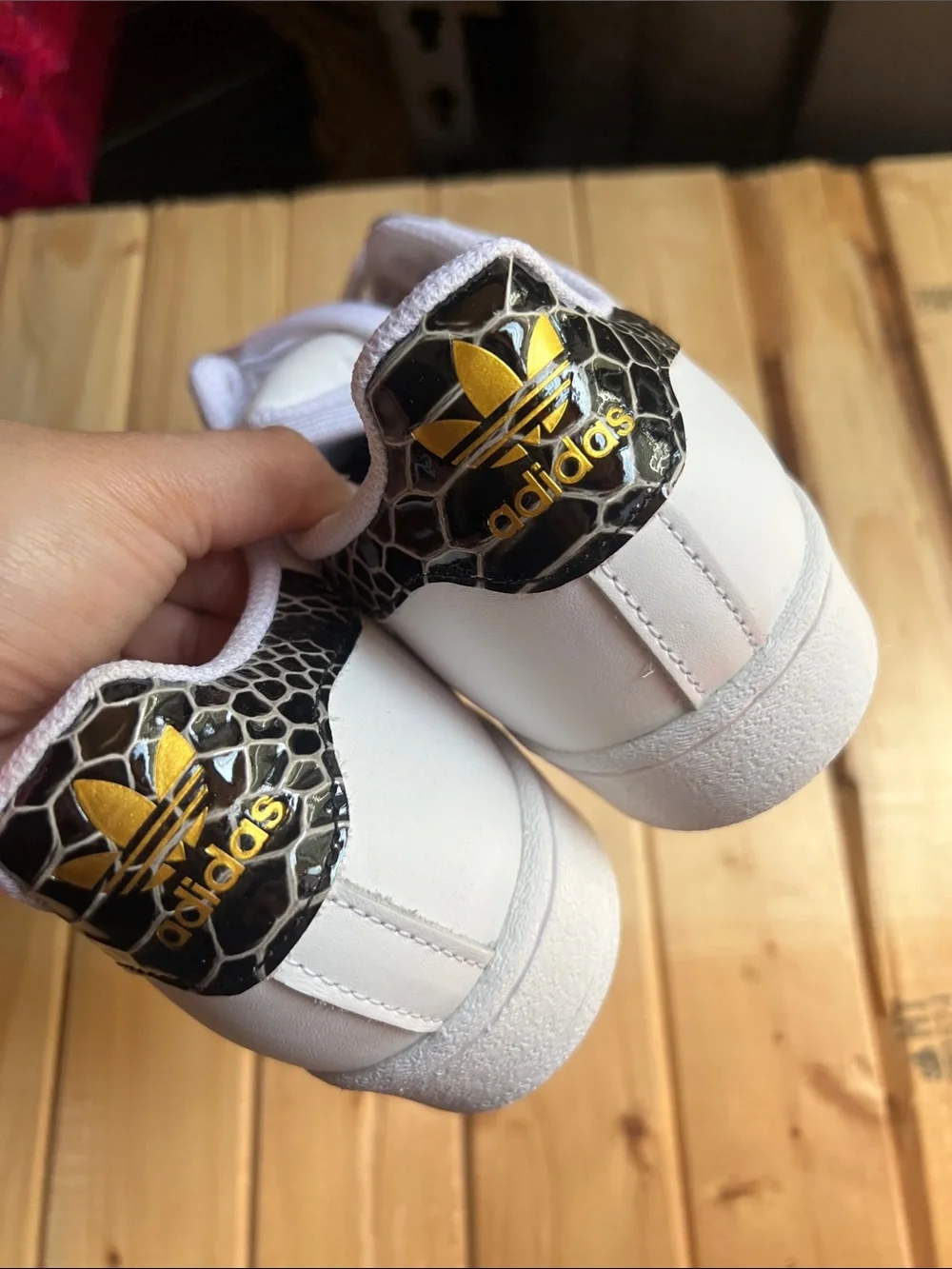 White Superstar Sneakers with Black Snakeskin Stripes